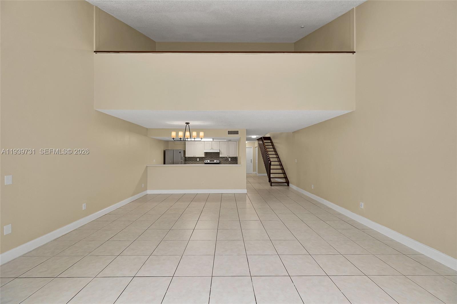 9079 Southwest 133rd Court, Unit F Miami, FL 33186 - Photo 18 of 34 a view of a kitchen with cabinets