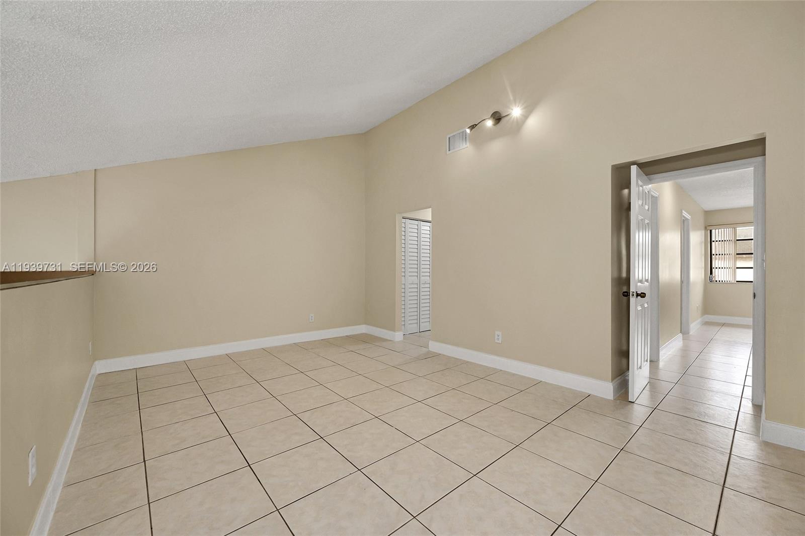 9079 Southwest 133rd Court, Unit F Miami, FL 33186 - Photo 27 of 34 a view of an empty room