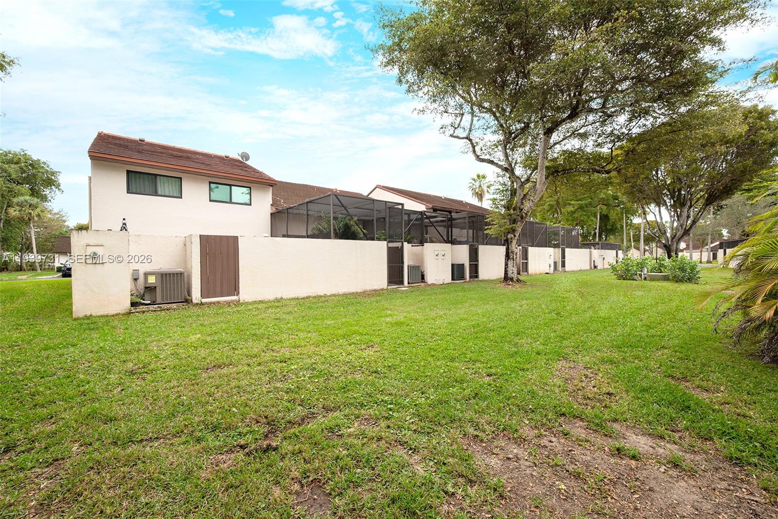 9079 Southwest 133rd Court, Unit F Miami, FL 33186 - Photo 31 of 34 a view of a house with backyard
