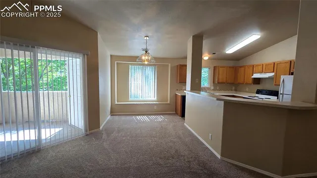 a view of a kitchen with a sink cabinets and a window