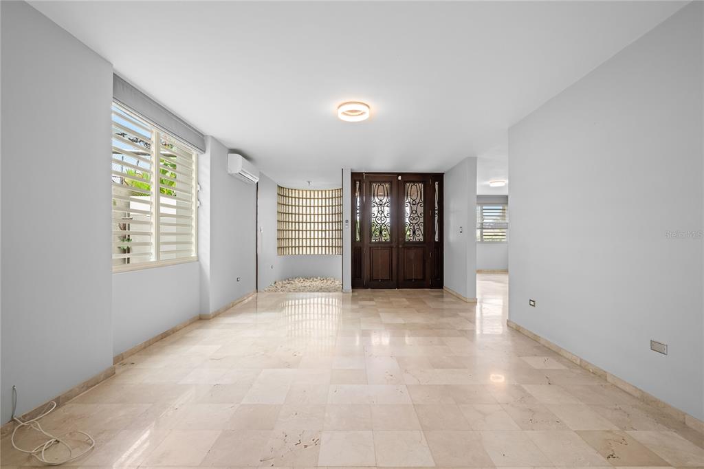 1 Street, Unit 606 Guaynabo, PR 00966 - Photo 11 of 32 an empty room with windows