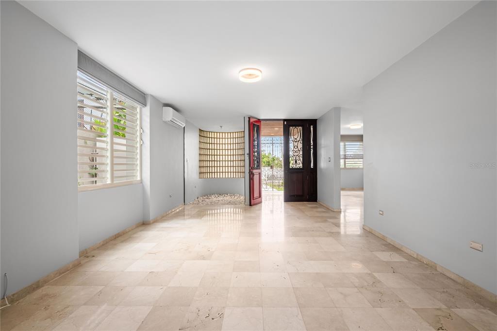 1 Street, Unit 606 Guaynabo, PR 00966 - Photo 12 of 32 a view of an empty room with a window and fire place