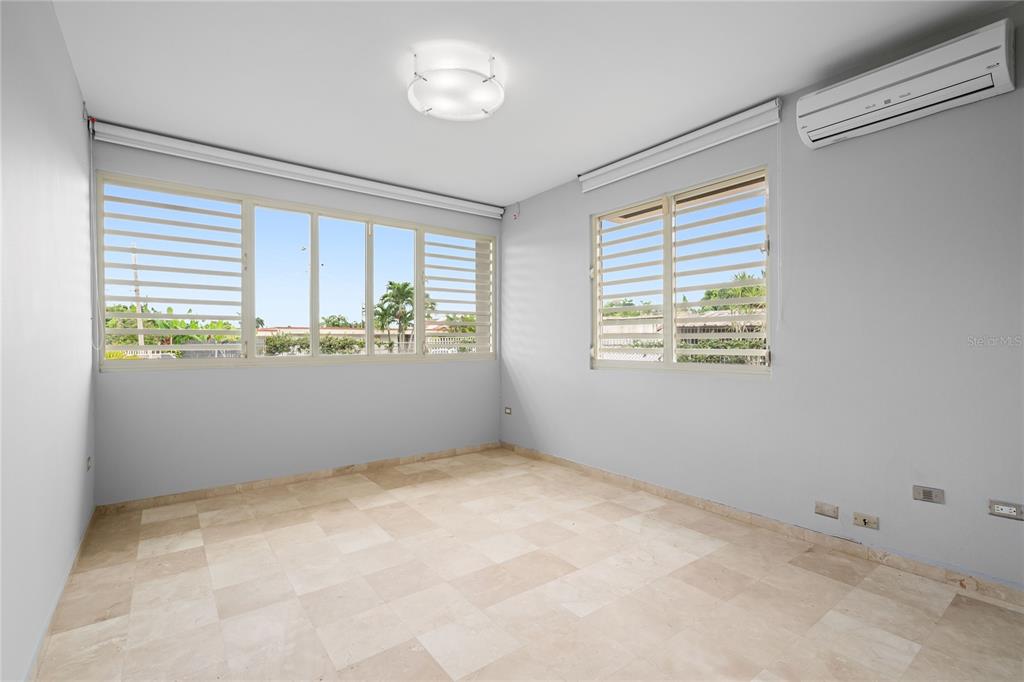 1 Street, Unit 606 Guaynabo, PR 00966 - Photo 13 of 32 an empty room with windows