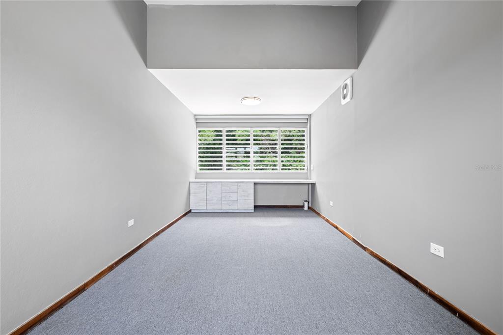 1 Street, Unit 606 Guaynabo, PR 00966 - Photo 15 of 32 a view of an empty room with a window