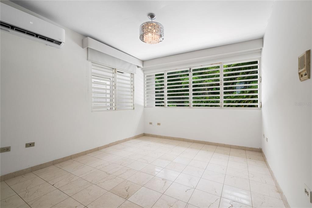 1 Street, Unit 606 Guaynabo, PR 00966 - Photo 19 of 32 a view of an empty room with a window