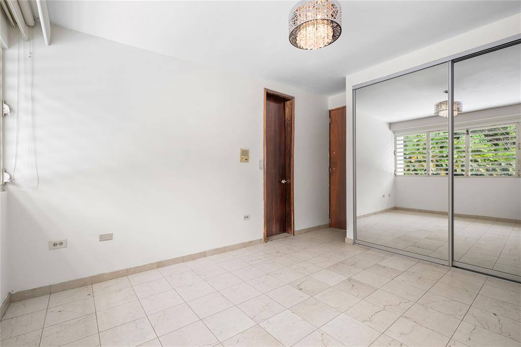 1 Street, Unit 606 Guaynabo, PR 00966 - Photo 20 of 32 a view of an empty room with a window