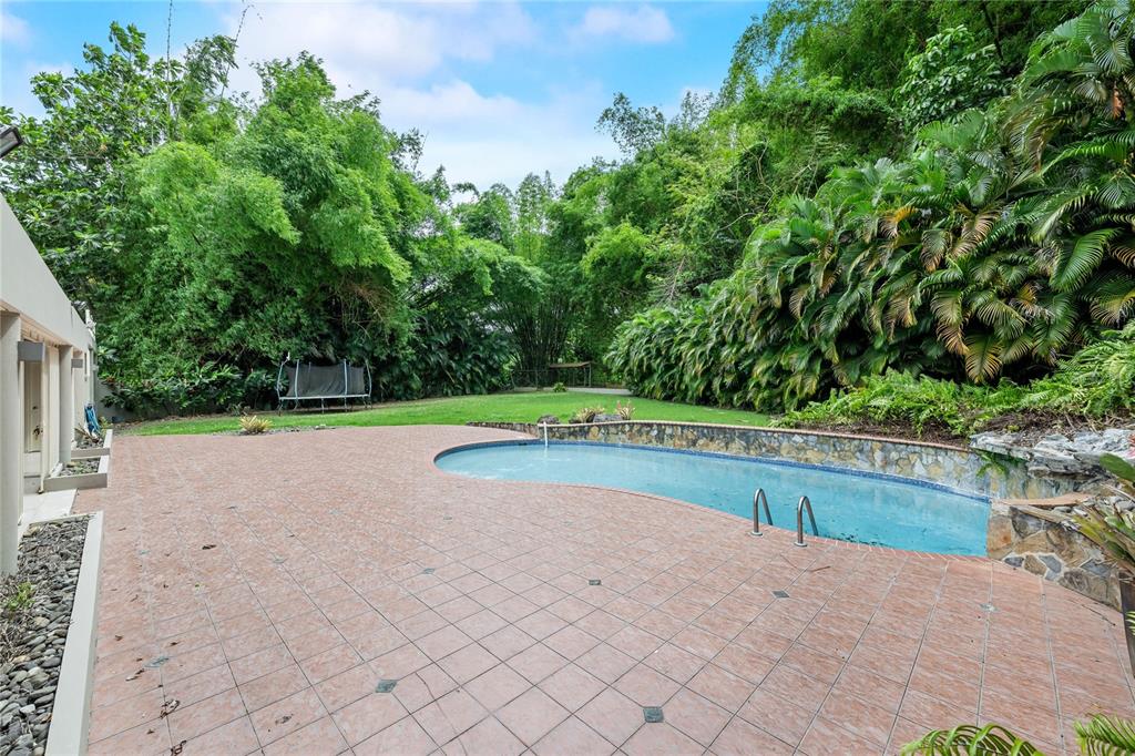 1 Street, Unit 606 Guaynabo, PR 00966 - Photo 3 of 32 a view of a swimming pool and a yard