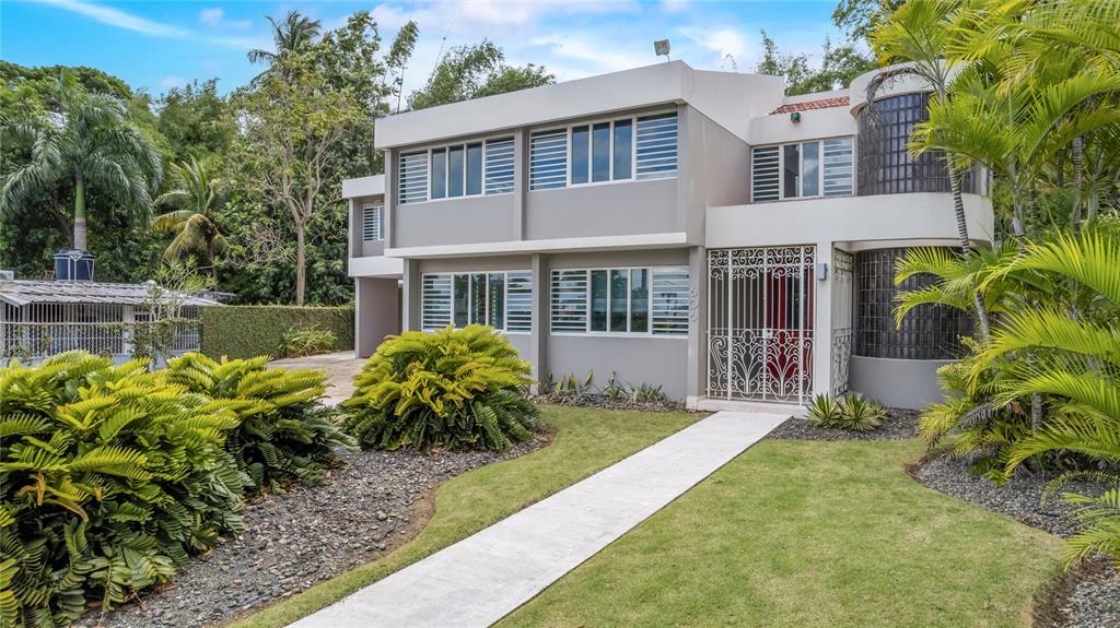 1 Street, Unit 606 Guaynabo, PR 00966 - Photo 32 of 32 a front view of a house with garden