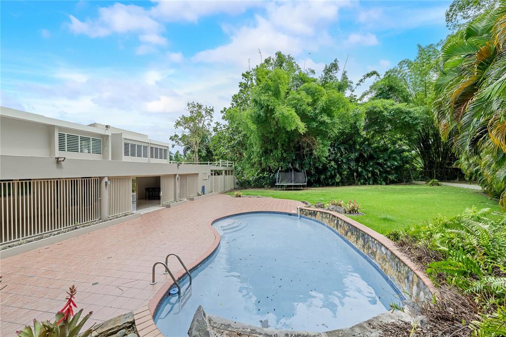 1 Street, Unit 606 Guaynabo, PR 00966 - Photo 4 of 32 a view of a house with a backyard