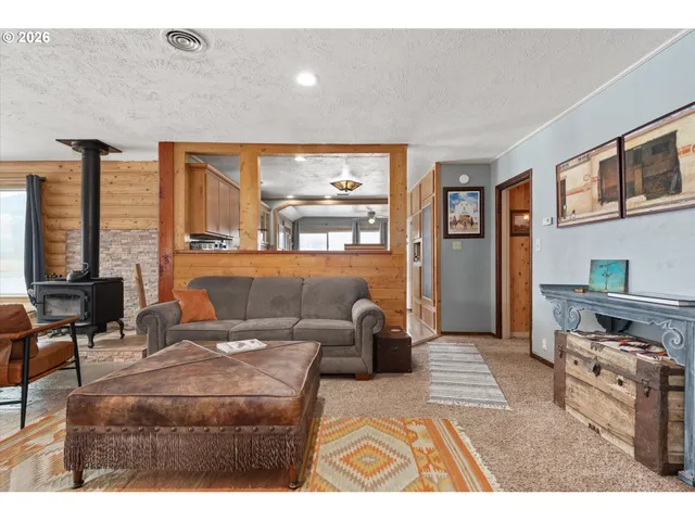 a living room with furniture and large window