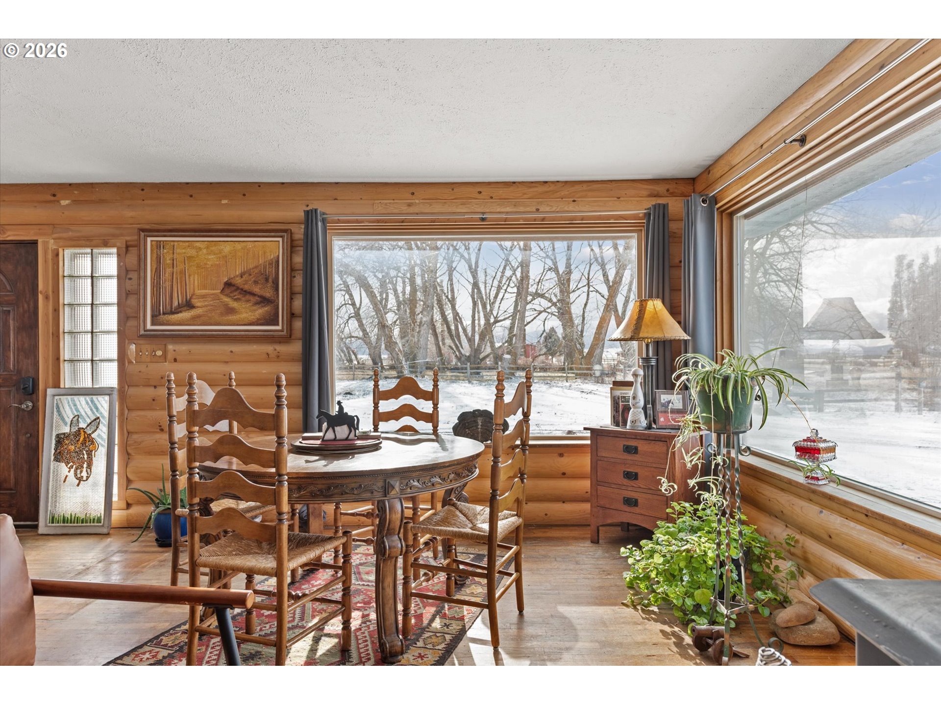 46278 Pocahontas Road Haines, OR 97833 - Photo 17 of 42 a dining room with furniture and a floor to ceiling window