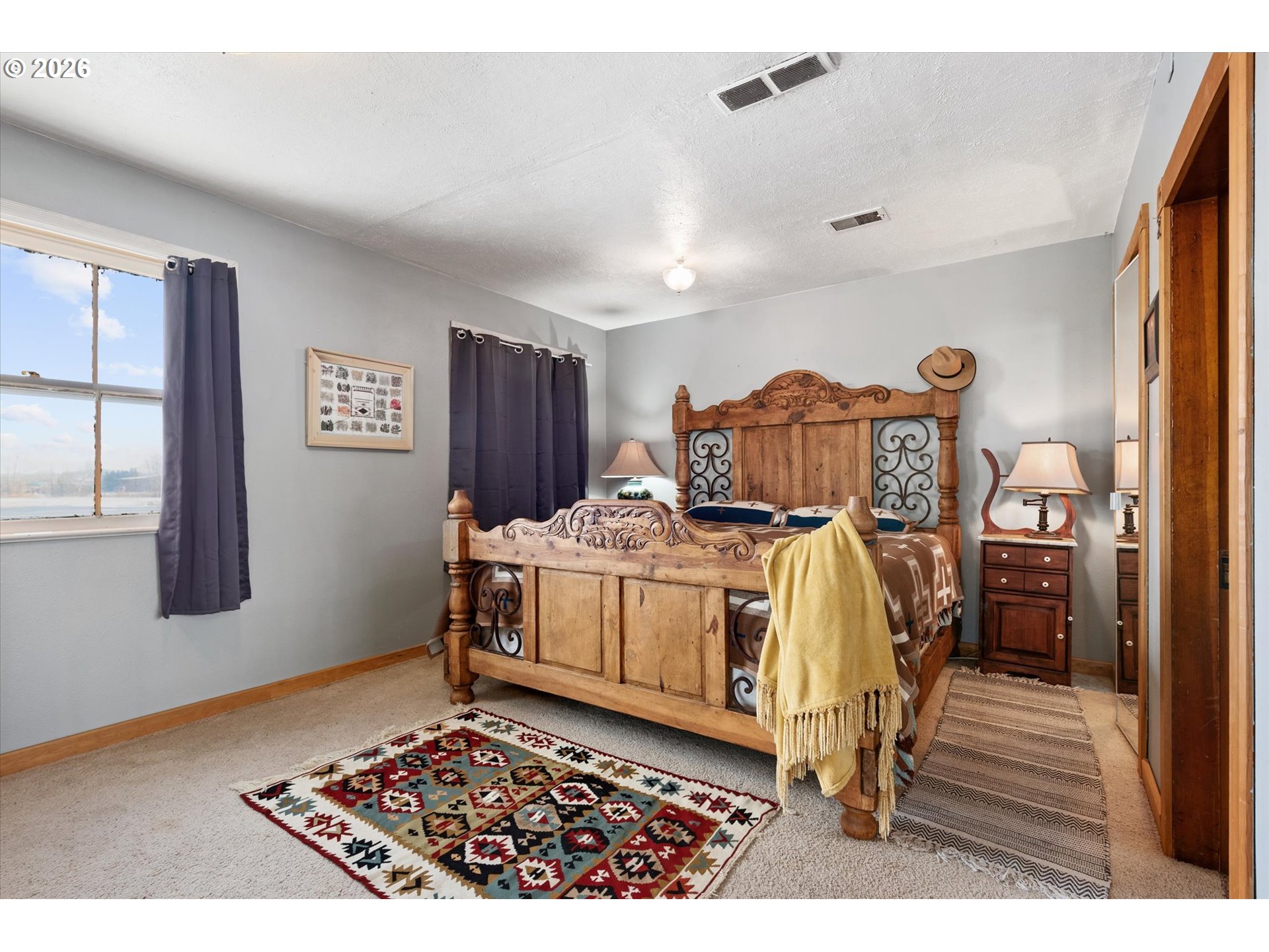 46278 Pocahontas Road Haines, OR 97833 - Photo 23 of 42 a bed sitting in a bedroom next to a window
