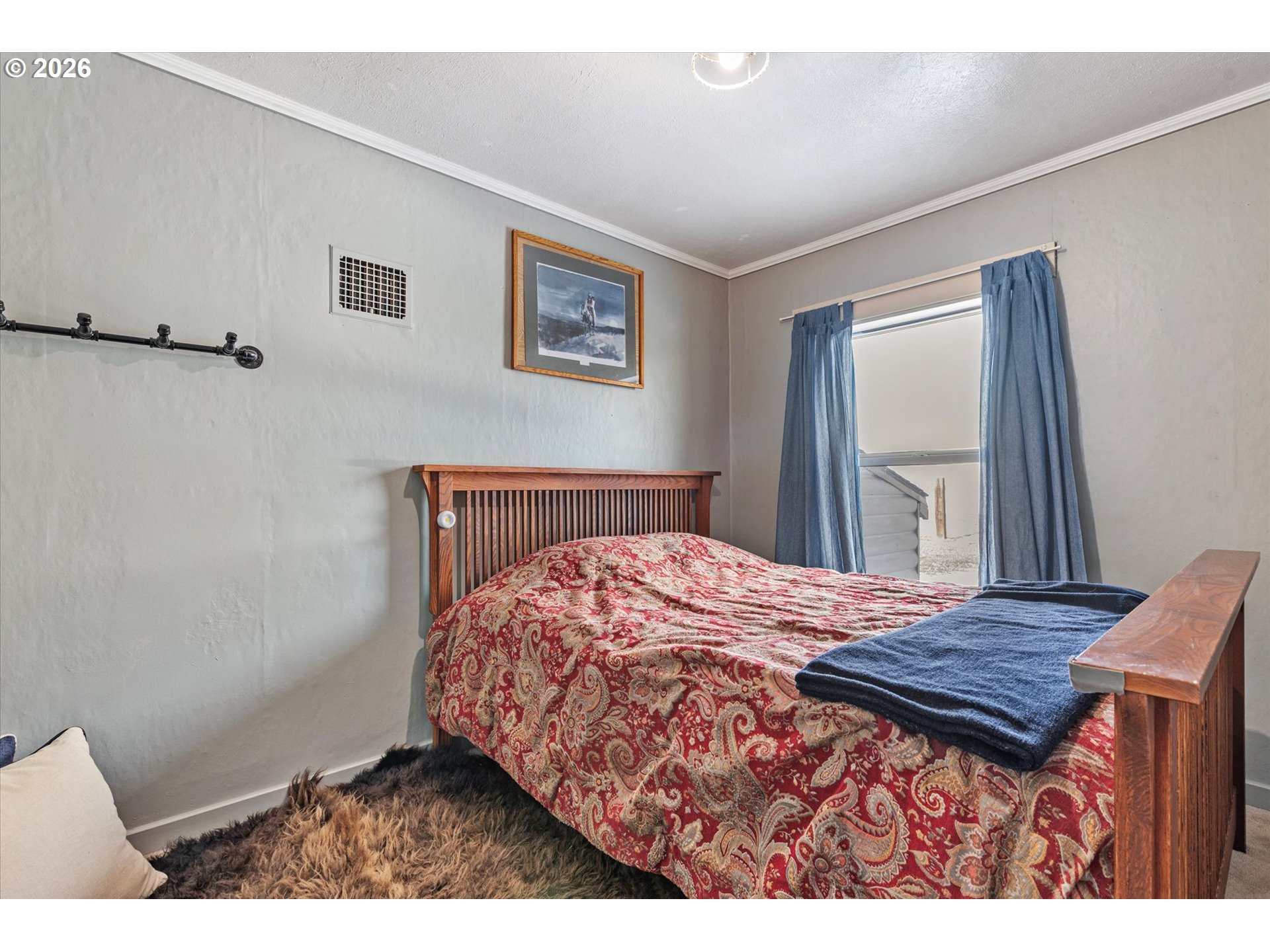 46278 Pocahontas Road Haines, OR 97833 - Photo 34 of 42 a bedroom with a bed and wooden floor