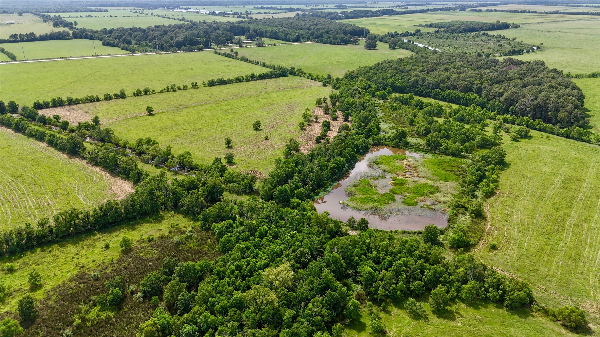 31100 Old Sour Lake Road Sour Lake, TX 77659 - Photo 28 of 32 a view of a lake with a houses