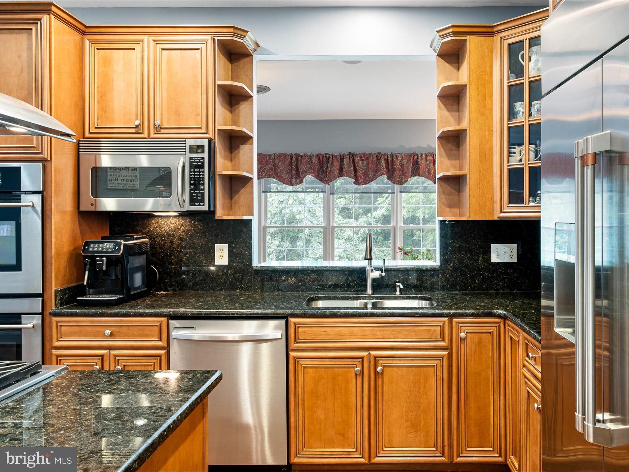 434 Spring Hollow Drive Middletown, DE 19709 - Photo 14 of 59 a kitchen with granite countertop a sink and a stove top oven