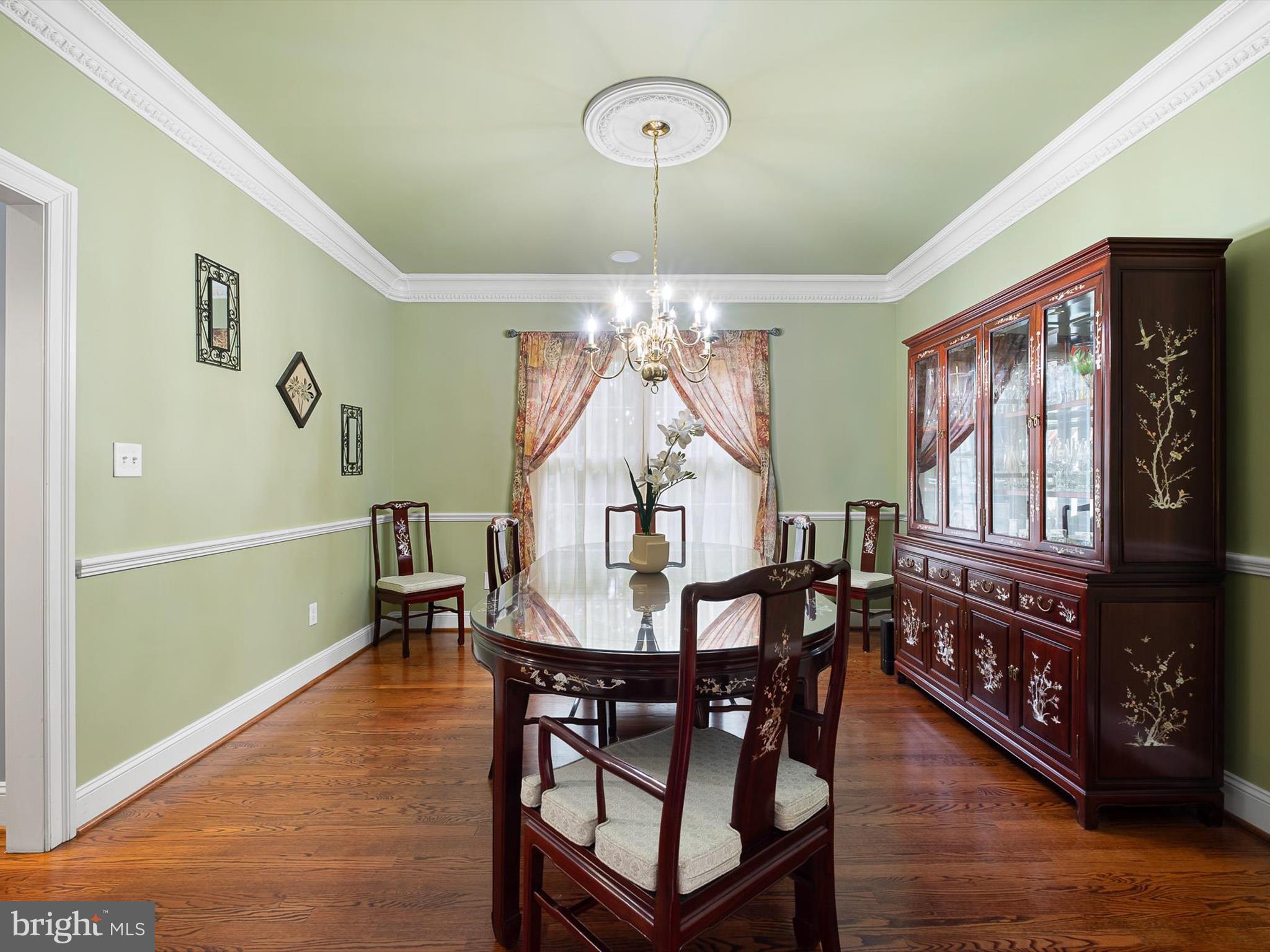 434 Spring Hollow Drive Middletown, DE 19709 - Photo 19 of 59 a view of a dining room with furniture window and wooden floor