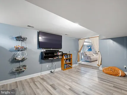 an aerial view of a house with a yard and trees