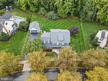 a backyard of a house with outdoor seating