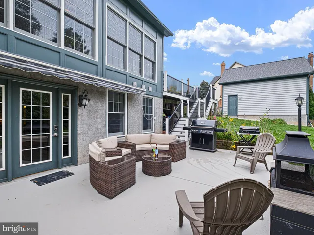 a view of a deck with furniture and wooden deck