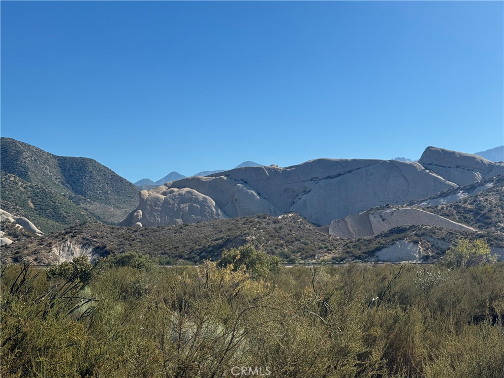 4292 Davis Ranch Road Phelan, CA 92371 - Photo 19 of 50 a view of a house with a mountain in the background