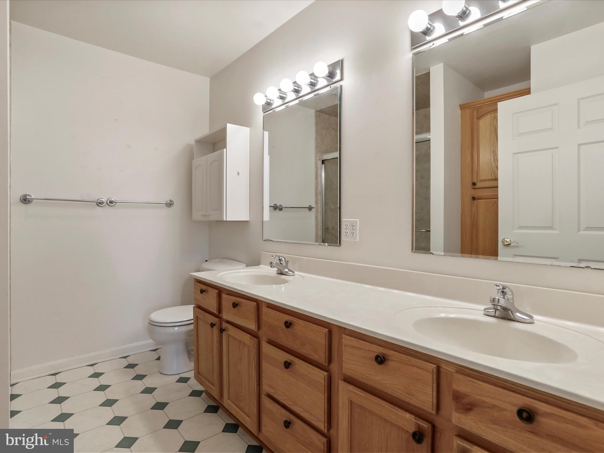 324 Key W Drive Hagerstown, MD 21740 - Photo 14 of 28 a bathroom with a double vanity sink mirror and toilet