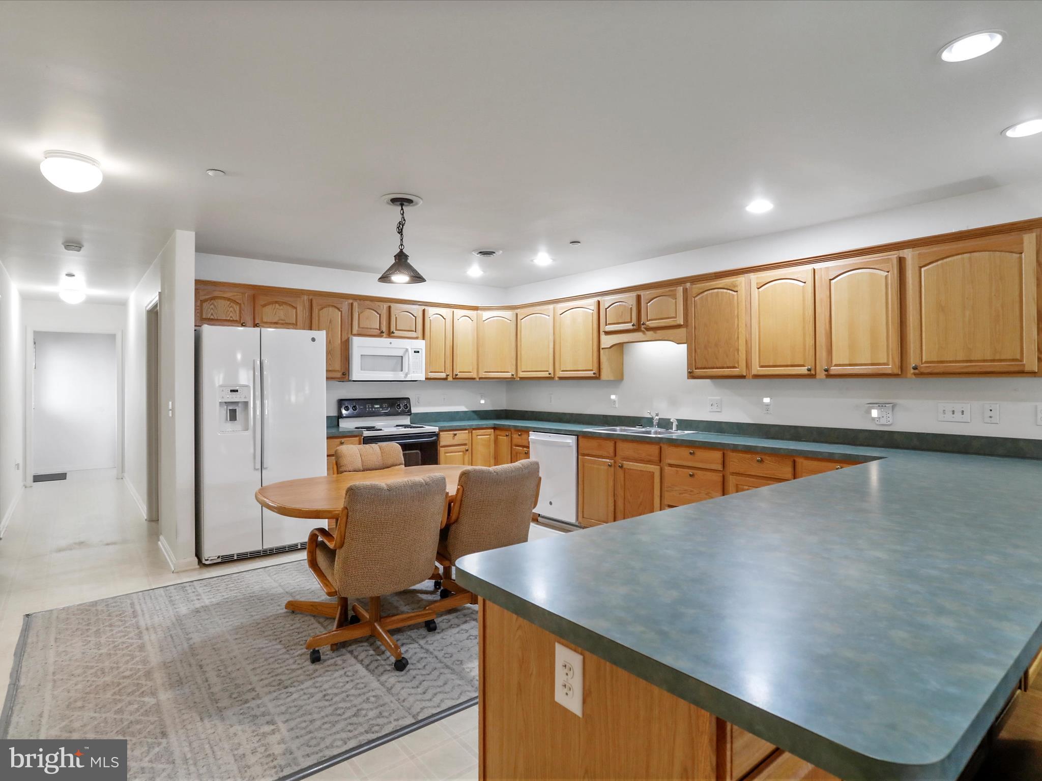 324 Key W Drive Hagerstown, MD 21740 - Photo 3 of 28 a view of kitchen with cabinets stainless steel appliances and dining table
