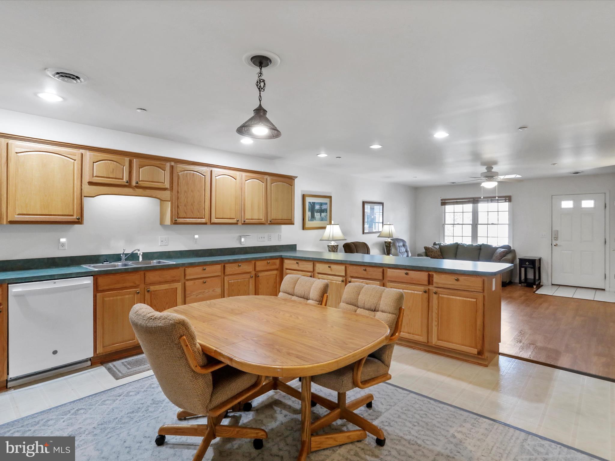 324 Key W Drive Hagerstown, MD 21740 - Photo 4 of 28 a kitchen with stainless steel appliances granite countertop a sink a stove a dining table and chairs