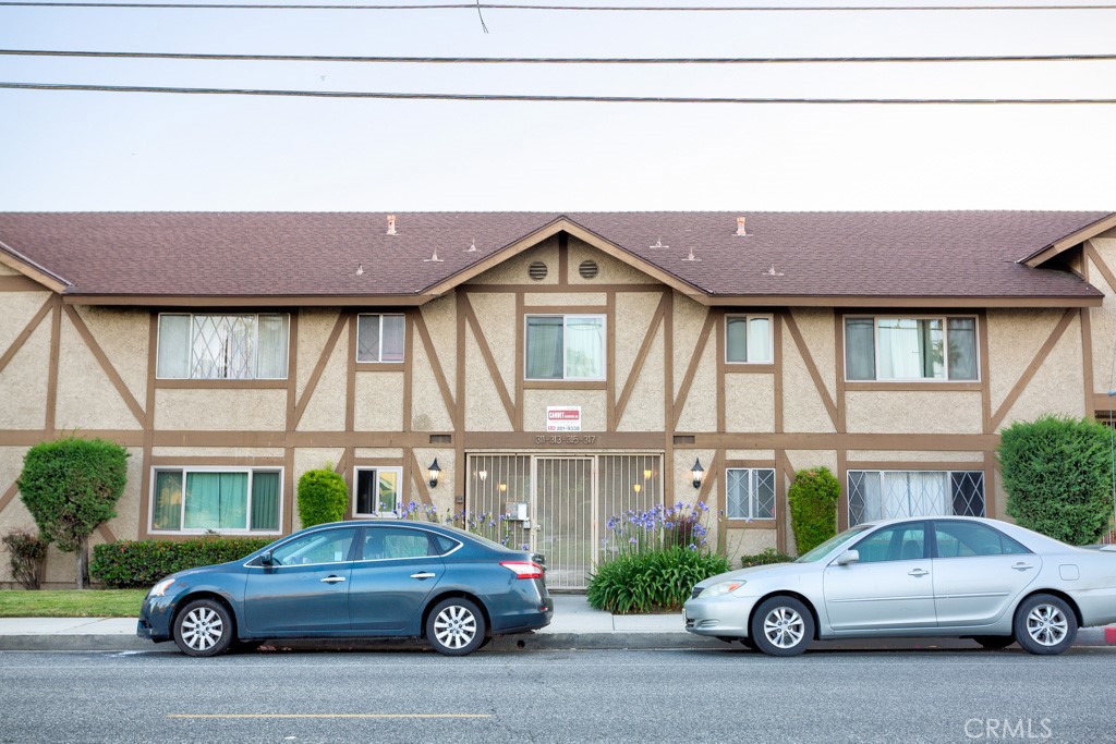 313 South Almansor Street, Unit 2 Alhambra, CA 91801 - Photo 2 of 39 a car parked in front of a house