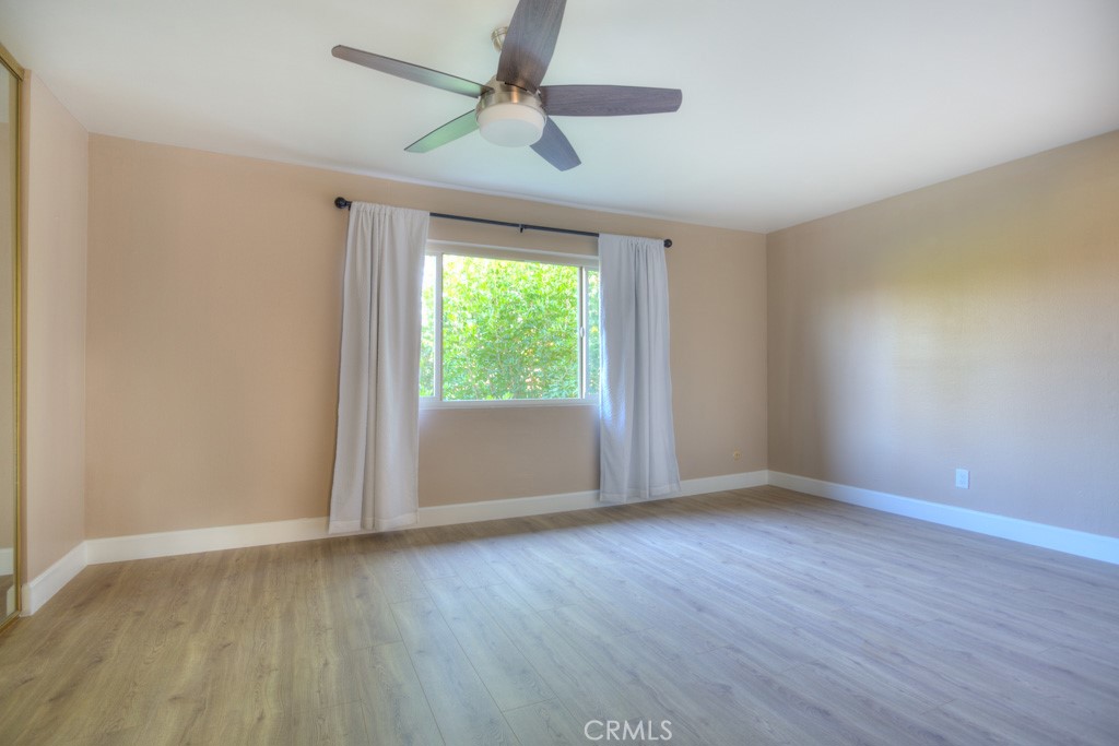 313 South Almansor Street, Unit 2 Alhambra, CA 91801 - Photo 24 of 39 a view of an empty room with wooden floor and a window