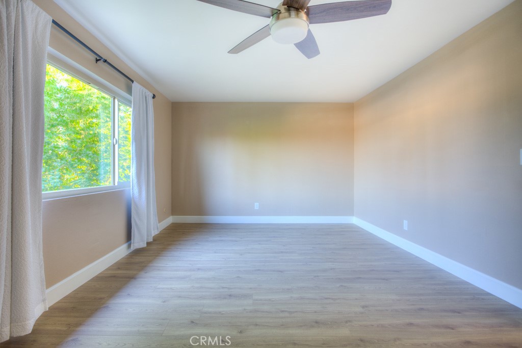 313 South Almansor Street, Unit 2 Alhambra, CA 91801 - Photo 26 of 39 a view of an empty room with a window and wooden floor