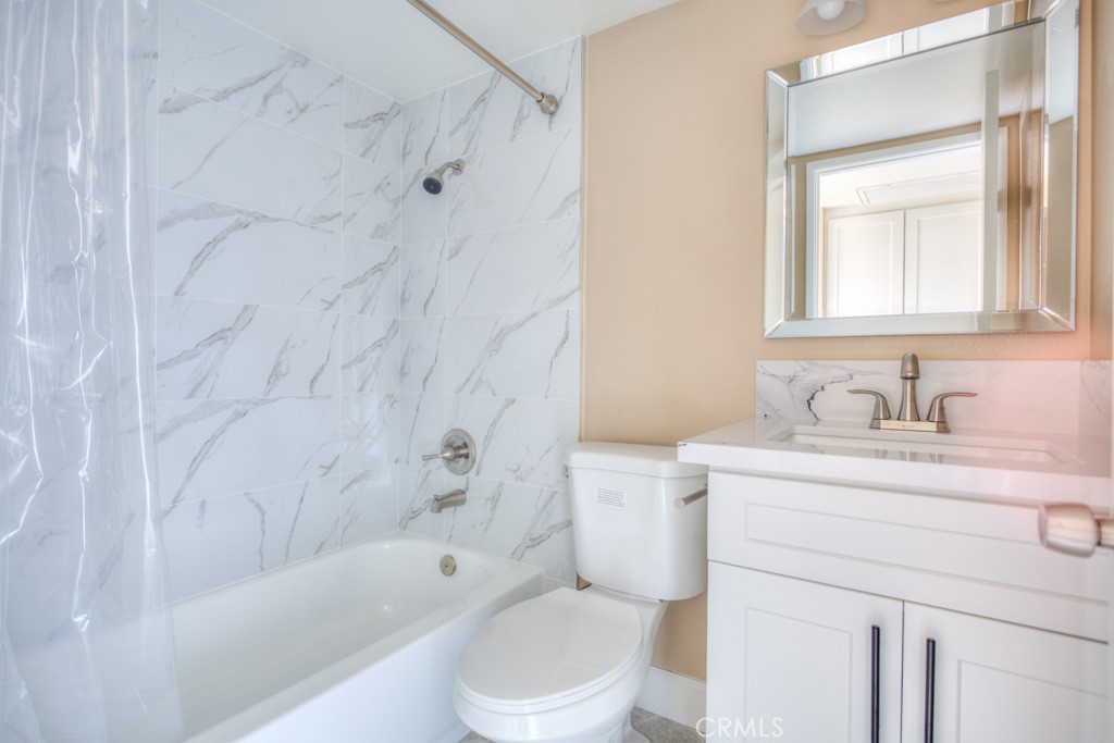 313 South Almansor Street, Unit 2 Alhambra, CA 91801 - Photo 28 of 39 a bathroom with a granite countertop sink toilet and shower