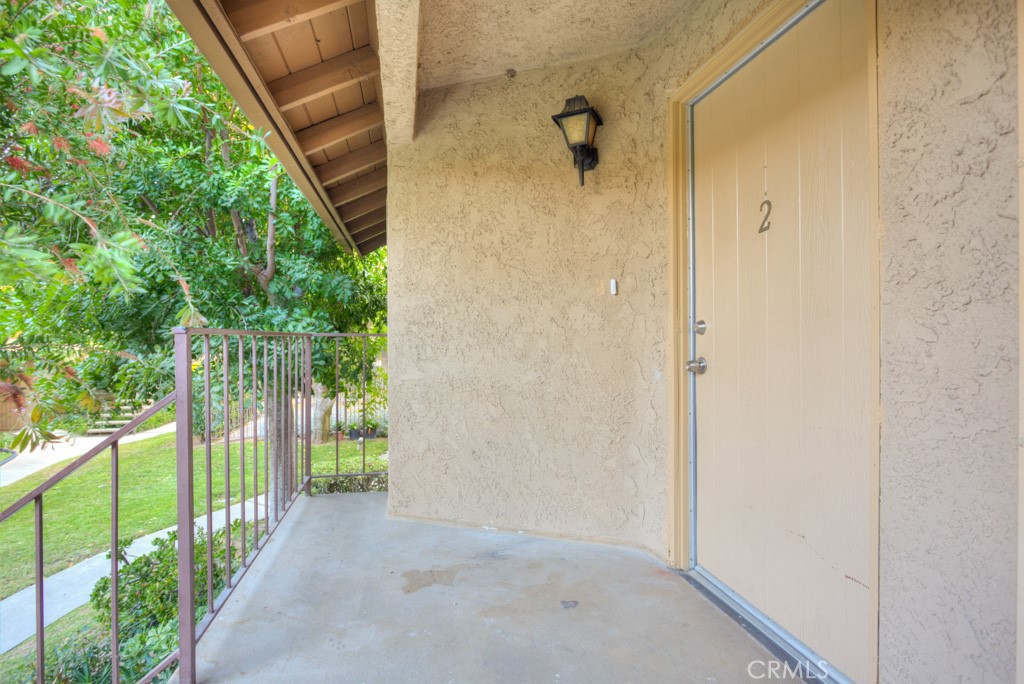 313 South Almansor Street, Unit 2 Alhambra, CA 91801 - Photo 33 of 39 a view of a pathway of a house with a street sign