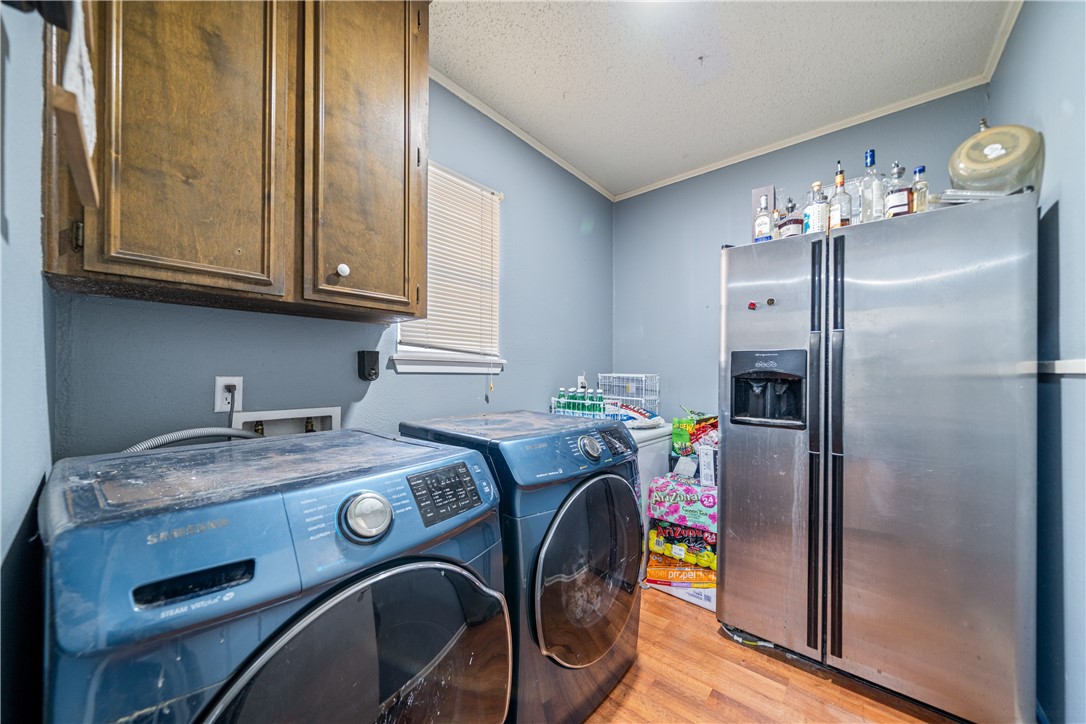2217 Post Oak Drive Portland, TX 78374 - Photo 16 of 39 a utility room with dryer and washer