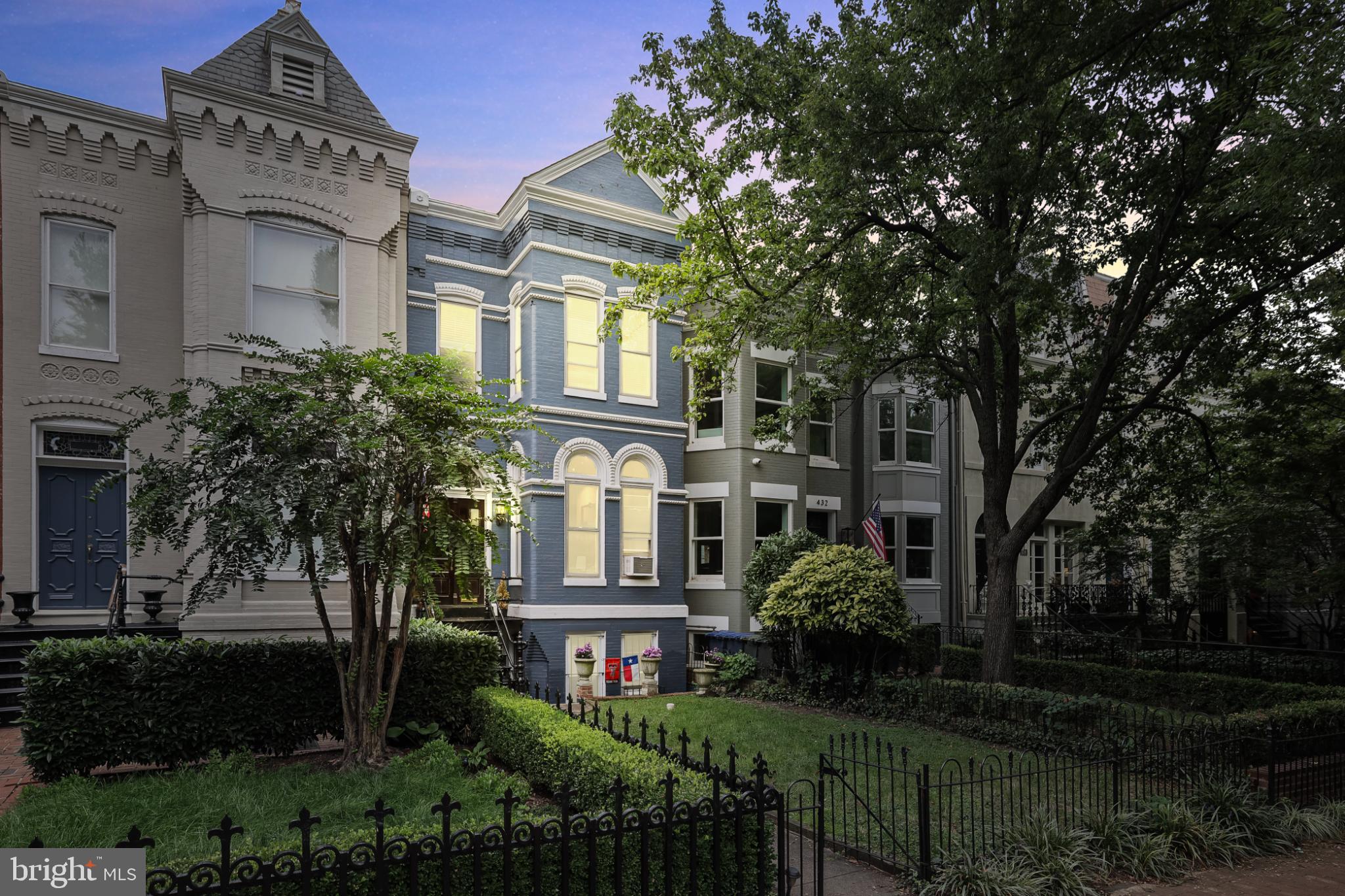 Charming homes framed by lush greenery.