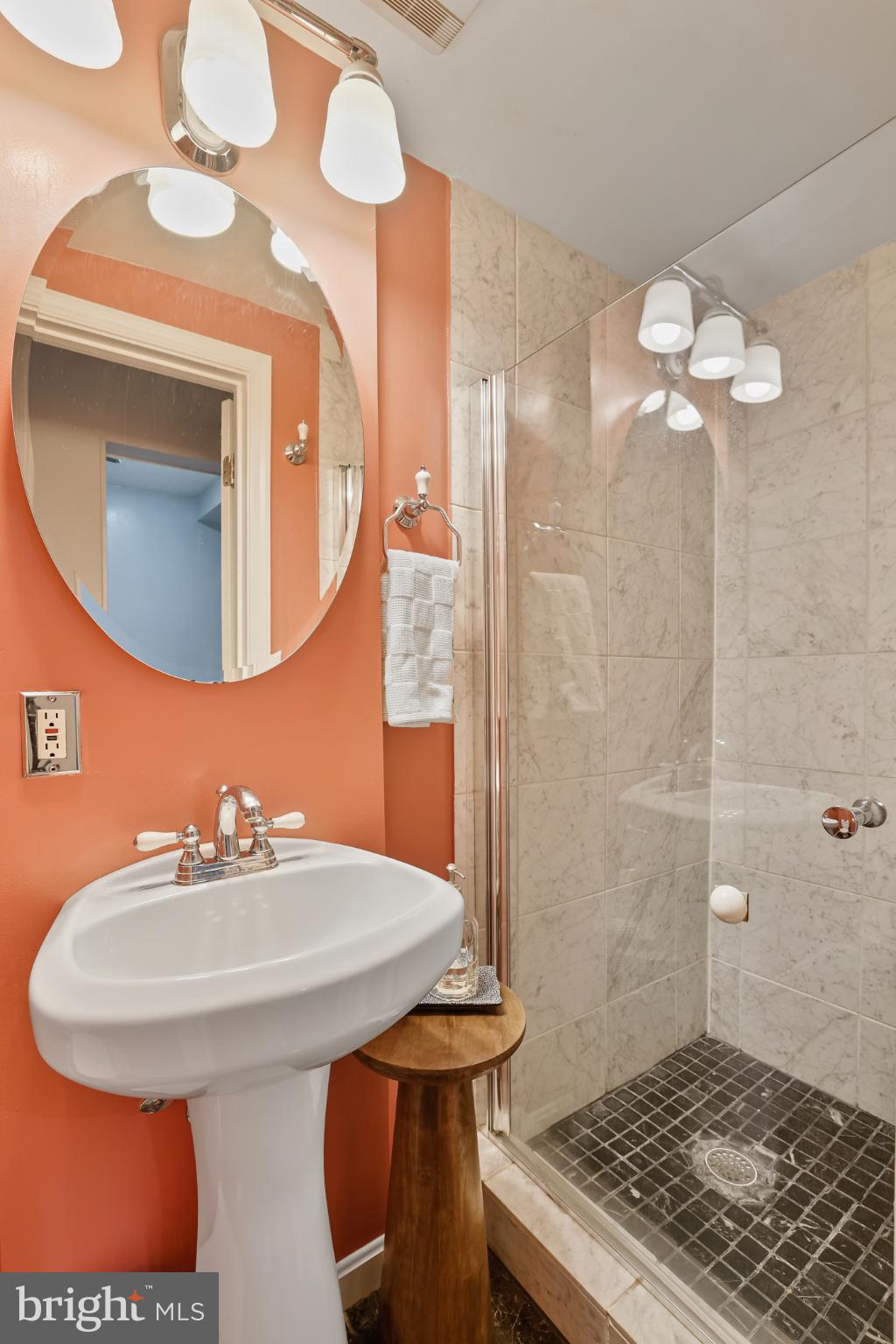 430 New Jersey Avenue Southeast Washington, DC 20003 - Photo 16 of 34 Chic bathroom with vibrant coral accents.