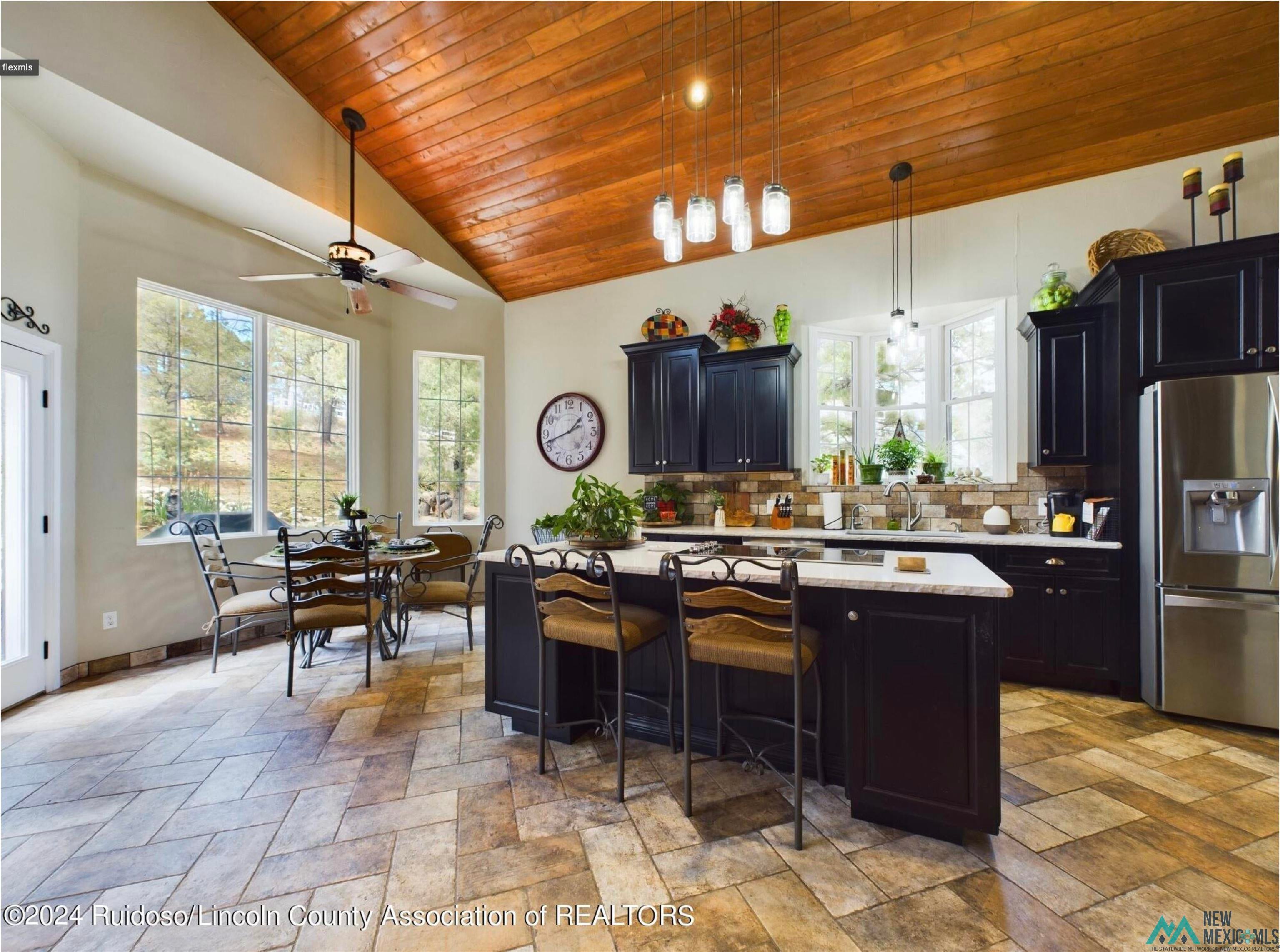 333 Ll Davis Drive Ruidoso, NM 88345 - Photo 12 of 25 Open-concept kitchen and dining area featuring a vaulted wood-finish ceiling
