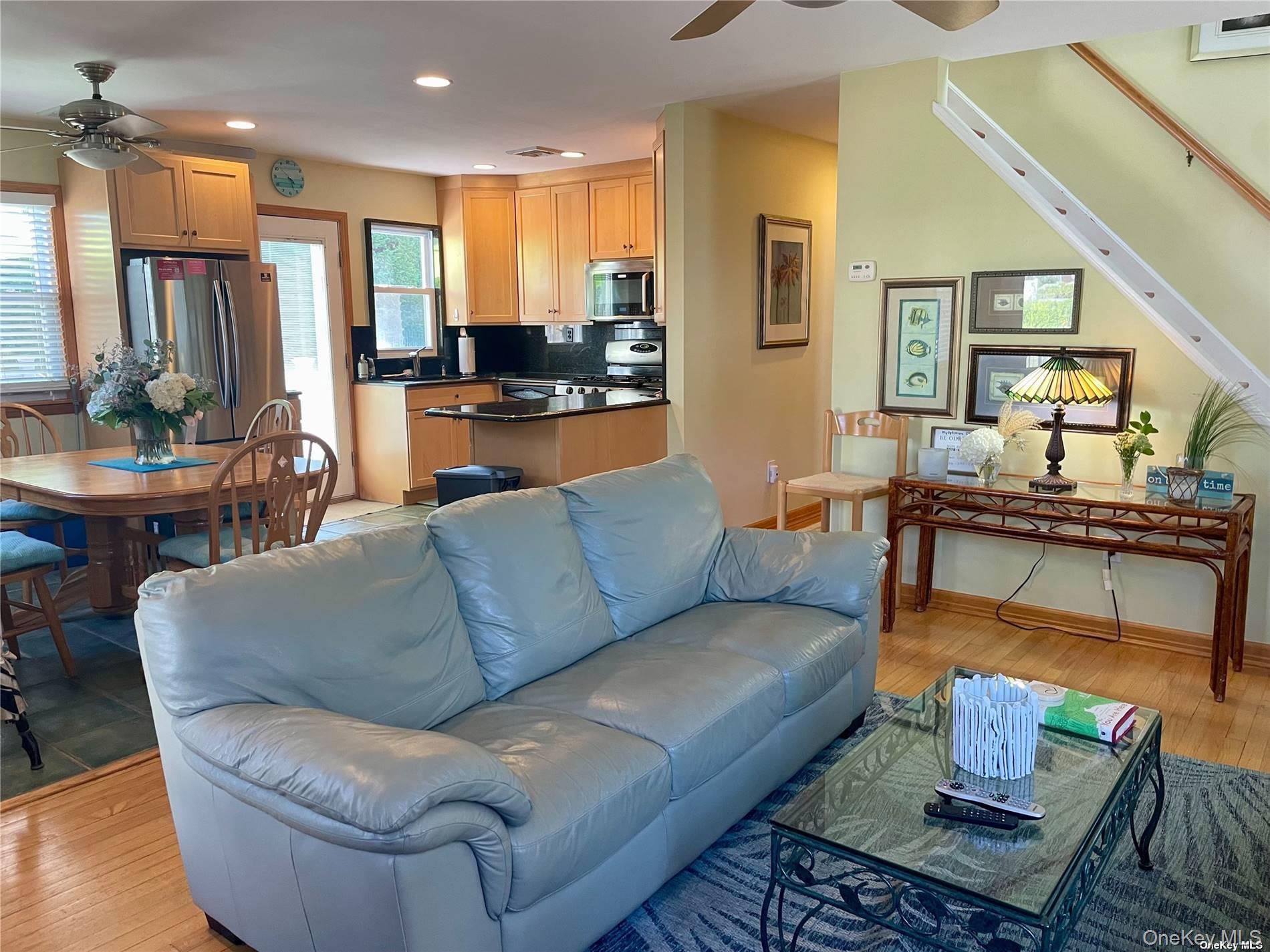 89 Lynbrook Avenue Point Lookout, NY 11569 - Photo 5 of 19 a living room with furniture kitchen view and a large window