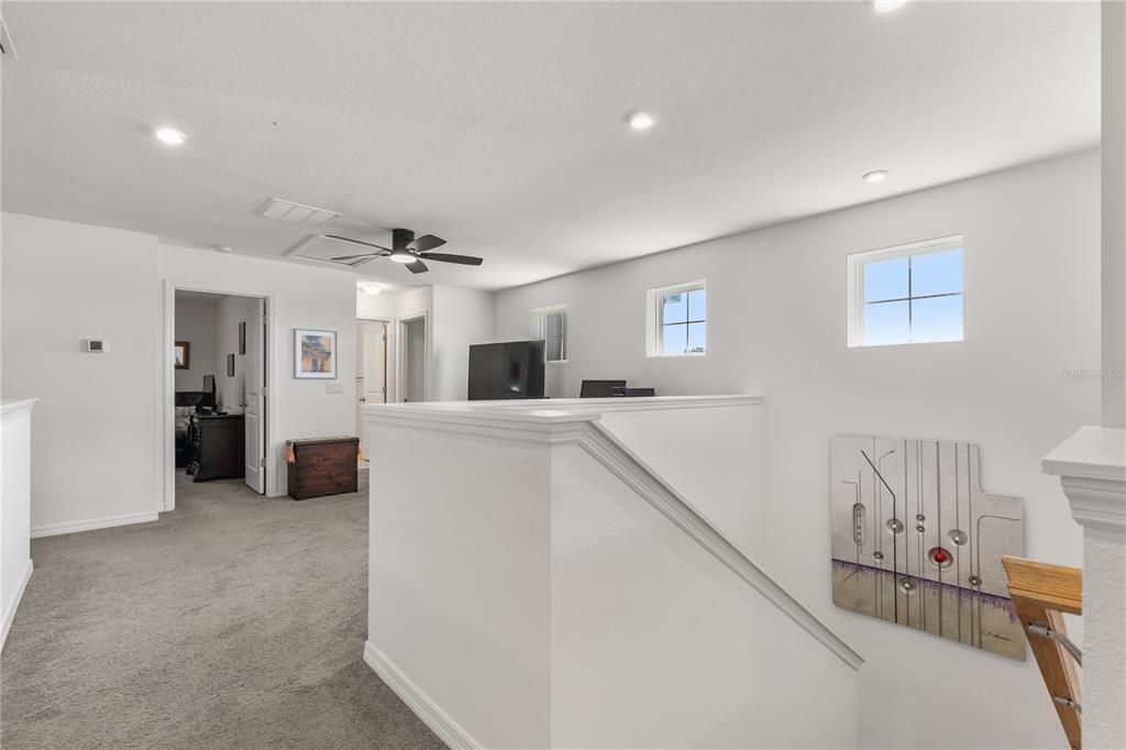 5637 Beggs Road St. Cloud, FL 34771 - Photo 16 of 35 a view of a kitchen with furniture and an entryway