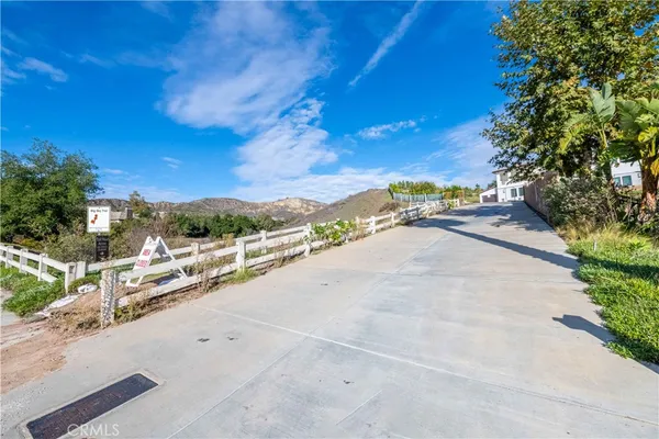 a view of a city street with a building