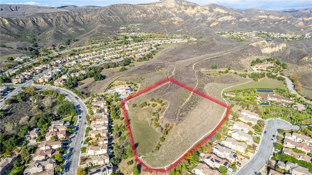 a view of a swimming pool with outdoor seating and plants