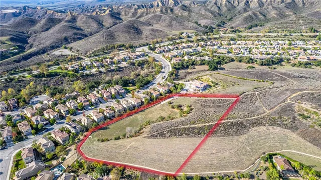a view of a city with mountains in the background