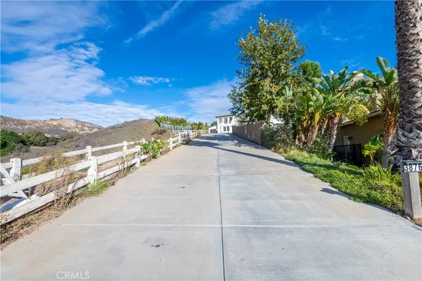 a view of a swimming pool with a yard