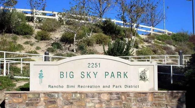 a view of a lake with a yard