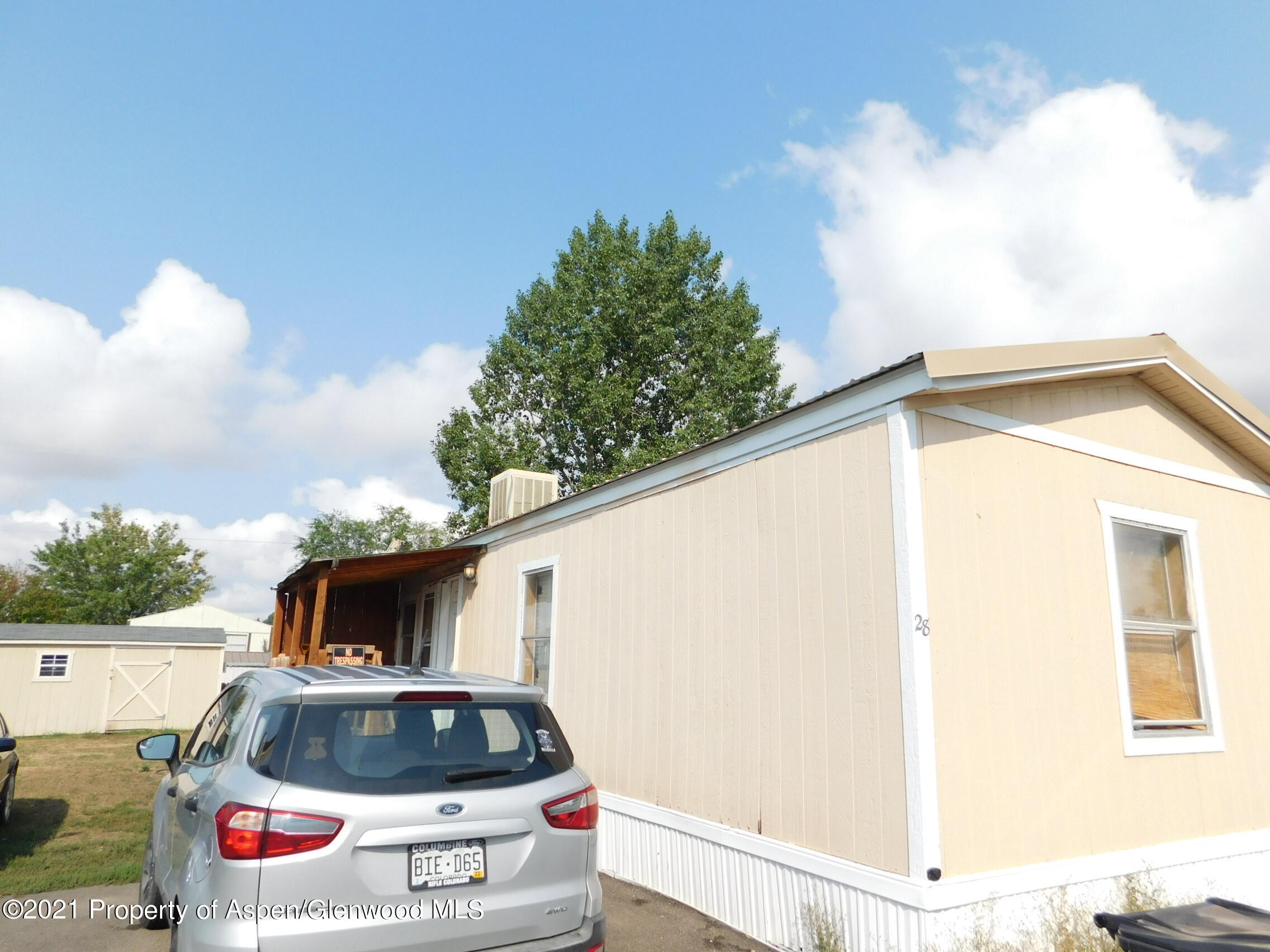 2210 West 3rd Street, Unit 28 Craig, CO 81625 - Photo 1 of 12 a car parked on the side of a road