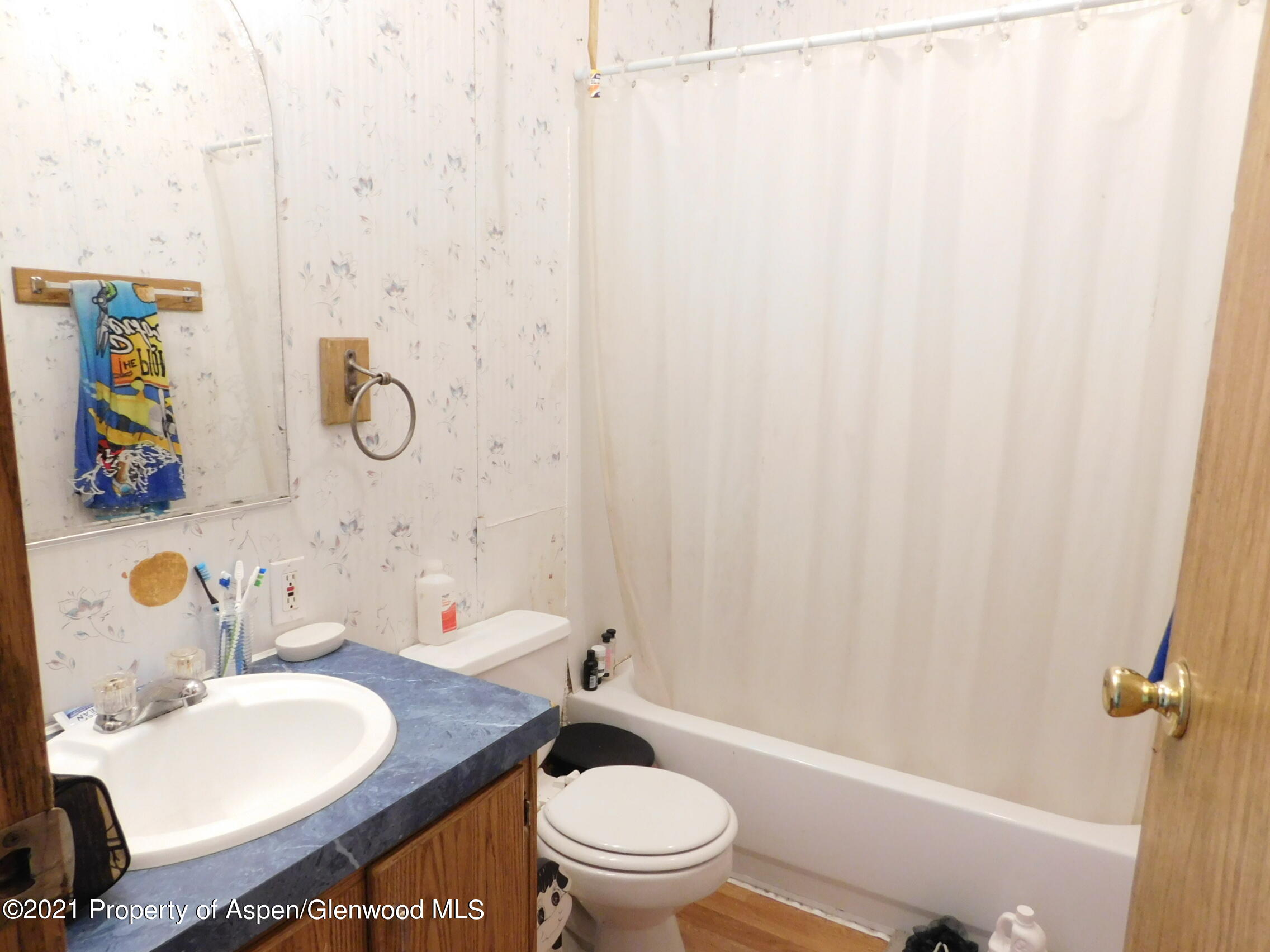 2210 West 3rd Street, Unit 28 Craig, CO 81625 - Photo 11 of 12 a bathroom with a sink toilet and shower
