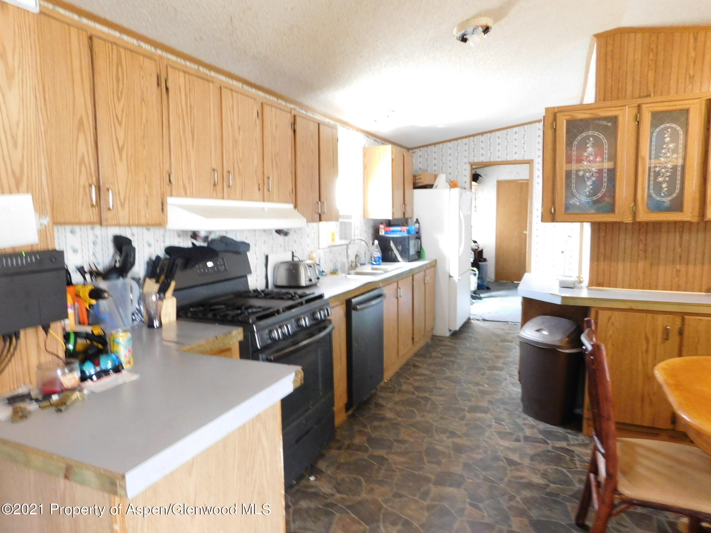 2210 West 3rd Street, Unit 28 Craig, CO 81625 - Photo 4 of 12 a kitchen with a sink appliances and cabinets