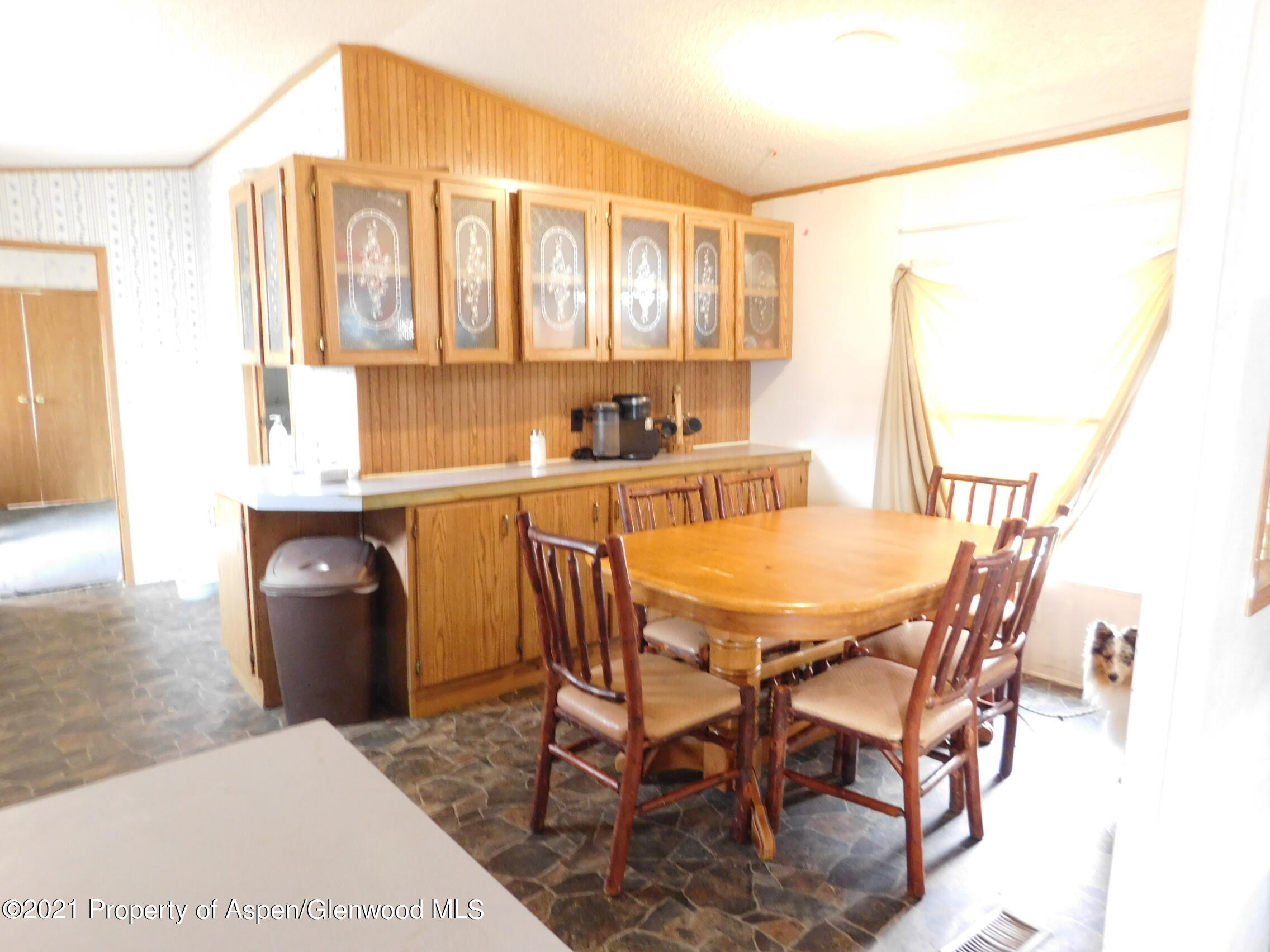 2210 West 3rd Street, Unit 28 Craig, CO 81625 - Photo 5 of 12 a dining room with furniture and window