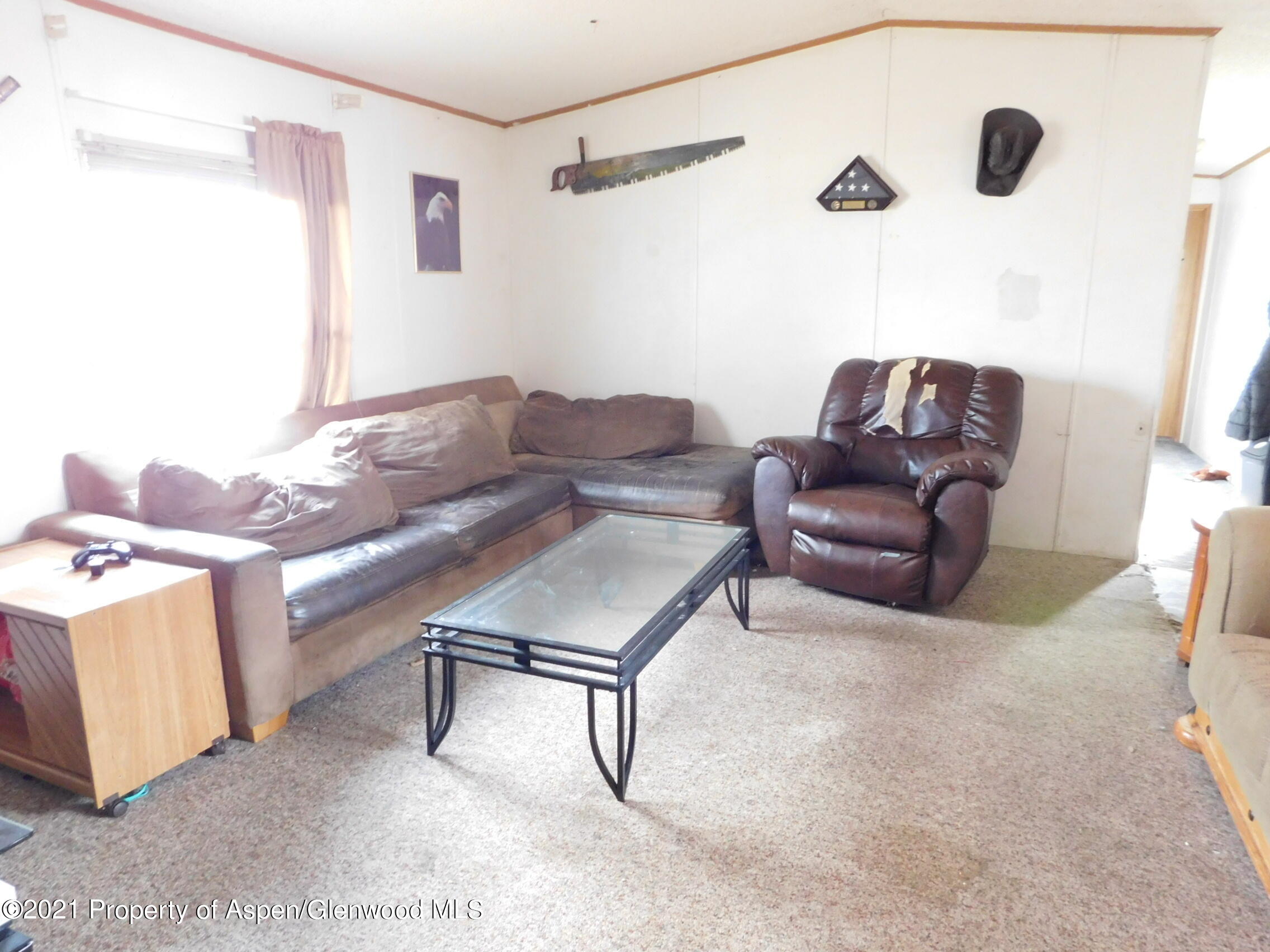 2210 West 3rd Street, Unit 28 Craig, CO 81625 - Photo 10 of 12 a living room with furniture and a couch