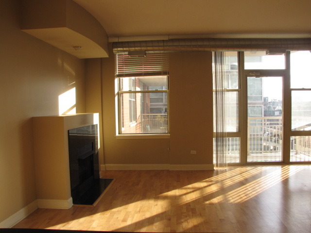 1001 West Madison Street, Unit 501 Chicago, IL 60607 - Photo 3 of 15 a view of an empty room with a window