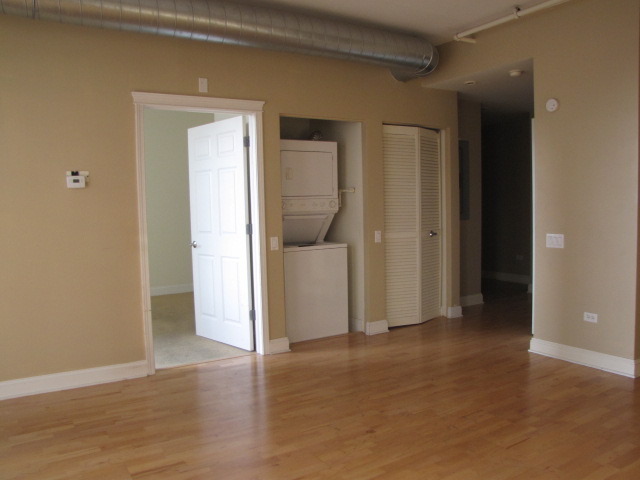 1001 West Madison Street, Unit 501 Chicago, IL 60607 - Photo 8 of 15 a view of a room with wooden floor